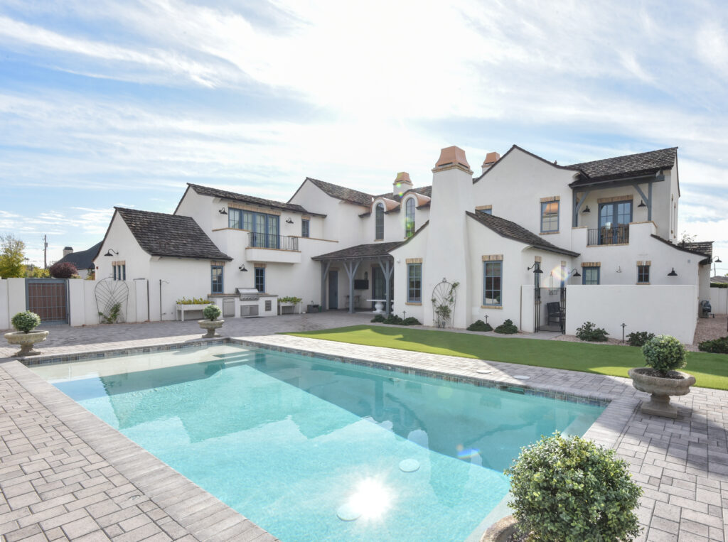 White stucco Arcadia estate with a pool