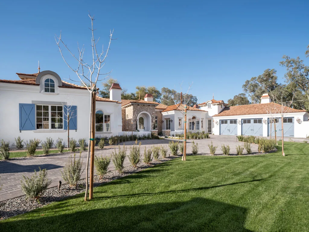 Spanish Mission-style luxury residence with white stucco and clay tile roofs